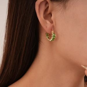 Luxury gold U-shaped hoop earrings with marquise-cut green zircon leaf patterns