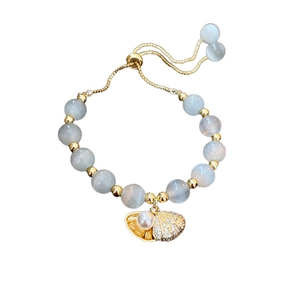 Gold plated bracelet with cat eye stone, pearl accents and adjustable pull-cord design