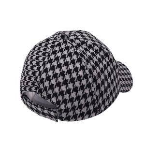 Classic houndstooth baseball cap with black and white pattern and adjustable back strap