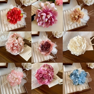 Elegant floral hair clips in nine diverse colors featuring fabric roses and mesh details