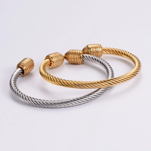 Two-tone twisted cable open bangle bracelets in polished gold and silver stainless steel