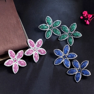 Detailed close-up of sparkling gunblack leaf flower earrings in green, rose and blue zircon