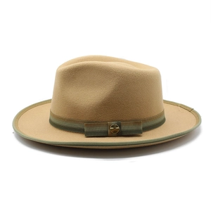 Detailed view of classic tan wool fedora with a striped band and vintage metal buckle