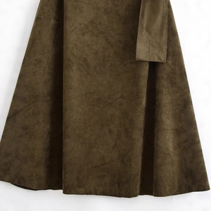 Chic dark brown faux suede asymmetrical dress featuring a belted waist and soft texture