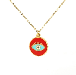 Close-up of red enamel evil eye pendant on a gold plated stainless steel necklace