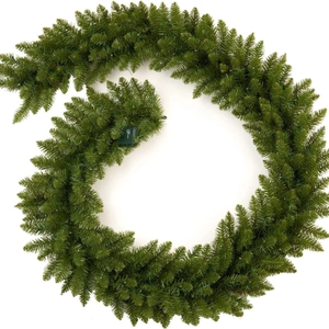 Macro detail of 9FT Christmas pine garland with warm LED lights and PVC needles texture