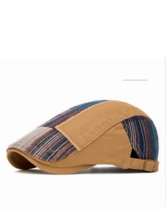 Detail of khaki patchwork flat cap showing stitching and bronze metal adjustment buckle