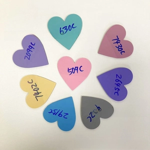 Detailed view of heart-shaped sticky note color samples in various vibrant acrylic shades