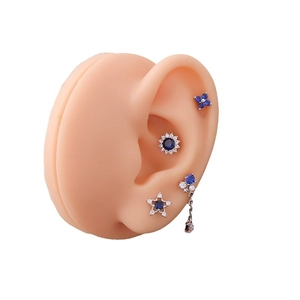 Blue zircon sunflower stainless steel cartilage stud earring set on silicone model