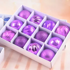 Set of 12 purple Christmas ornaments with glitter and matte finishes in a white gift box