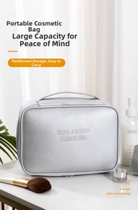 Close-up of silver PU leather makeup bag with textured surface and handle in natural light