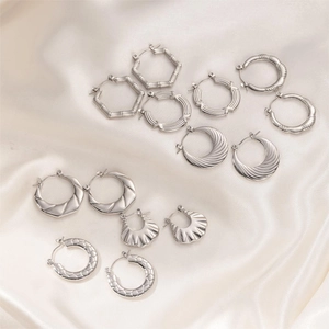 Detailed set of silver stainless steel hoop earrings with bamboo and spiral textures