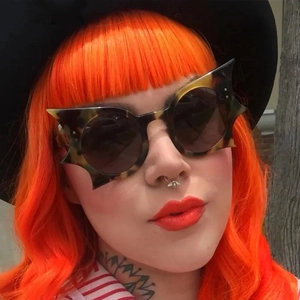 Trendy bat-shaped tortoise shell sunglasses with dark lenses for stylish women