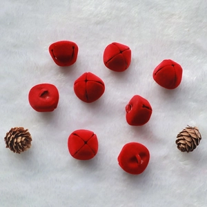 Set of 8 red velvet Christmas bells with cross cutout and pine cones on white fur
