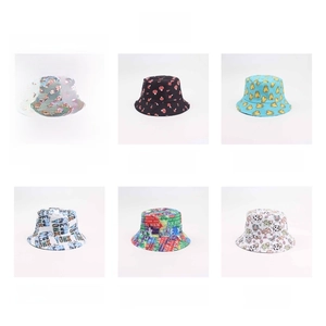 Detail view of six reversible bucket hats featuring colorful mushroom and cow prints