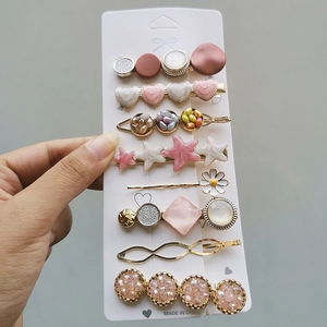 Detail view of 8-piece candy-colored hair clip set with pearls and floral motifs