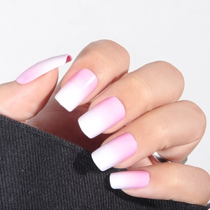 Pink and white gradient matte press-on nails in square shape on hand with white background