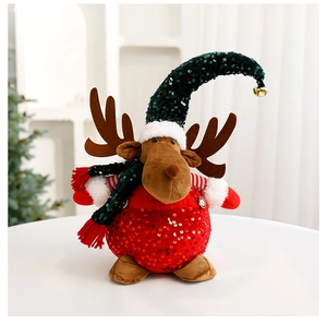 Detailed view of a Christmas reindeer plush toy with red sequins and bell ornament