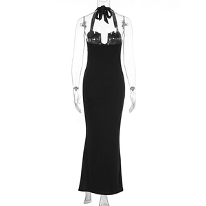 Detail of backless black maxi dress with elegant bow tie-up design and slim fit