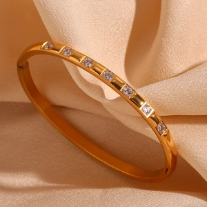 18K gold plated stainless steel bracelet with eight round sparkling zircons on satin