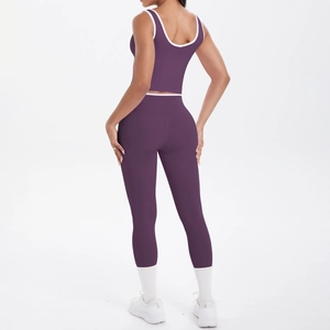 Back view of high-waist yoga set with purple contrast piping and cutout sports bra