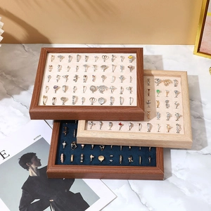 Walnut wood jewelry tray with velvet slots for rings and earrings display