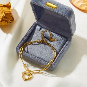 Elegant gold stainless steel paperclip bracelet with a sparkling crystal heart pendant