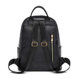 Minimalist black faux leather backpack with gold zippers and large capacity for commuting