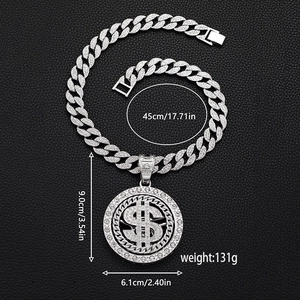 Silver iced out rotating dollar sign pendant with cuban link chain hip hop jewelry