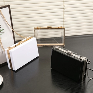 Chic acrylic box clutches in white, black and clear with elegant gold metal chains