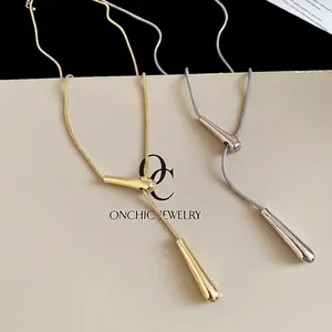Minimalist metallic teardrop pendant necklaces in gold and silver with snake bone chains