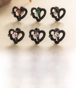 Detail view of 0.8x6mm heart-shaped zircon ear studs with secure screw-on balls in titanium steel
