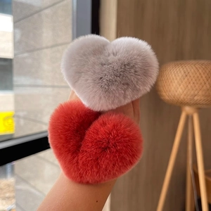 Cute heart-shaped plush hair ties in gray and red faux rabbit fur for women and girls