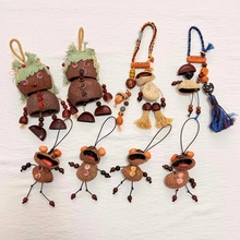 Detailed macro shot of handmade nut and seed craft pendants with woven fibers