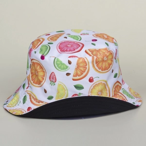Detail of double-sided bucket hat with colorful fruit print and black inner lining