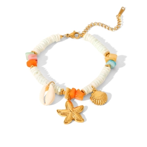 Close-up of Bohemian 18k gold starfish and shell charms on colorful beaded bracelet
