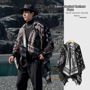 Detail of color-block paisley poncho featuring minimalist short fringe and vintage design
