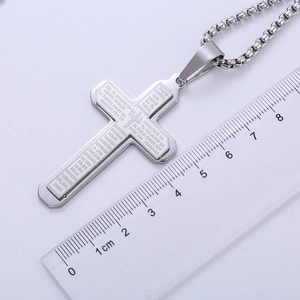 Silver cross pendant with Spanish Lord's Prayer engraving and size reference ruler