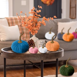 Assorted colorful velvet decorative pumpkins for festive home and holiday decor