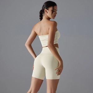 Detail of high-waisted seamless yoga set with scrunched texture in cream beige