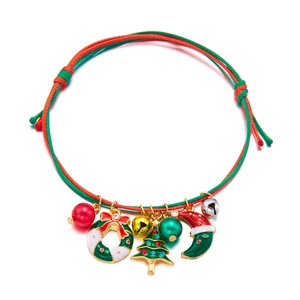 Detailed view of woven Christmas bracelet with colorful alloy holiday-themed pendants