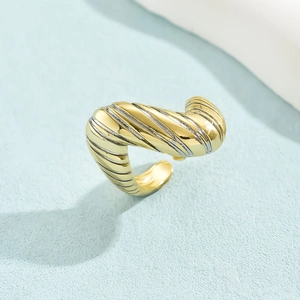 Detail shot of the twisted gold texture on an adjustable minimalist 18K plated ring