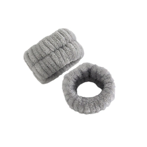 Close-up of light grey microfiber headbands and wristbands with soft plush texture