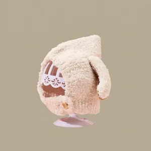 Detailed texture of cozy beige fleece kids winter hat with a decorative wood button