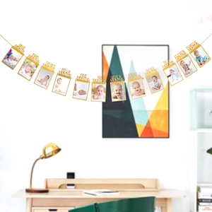 Detail of glitter gold photo banner with monthly frames for baby's first birthday party