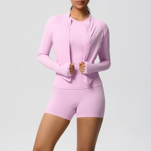 Detail of high-stretch fast-drying fabric on light pink three-piece yoga set for women