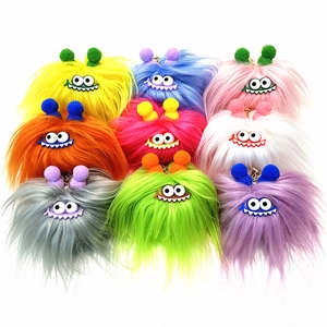 Detailed view of colorful plush monster keychains in nine vibrant fur colors with metal clips