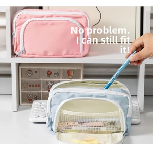 Detail of pink and blue large pencil cases showing multi-layer zippers and mesh pockets