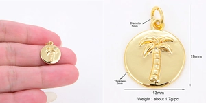 Detail view of gold coconut tree round charm with precise dimensions and size scale
