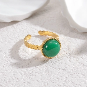French vintage adjustable oval ring in gold with hammer texture and green gemstone